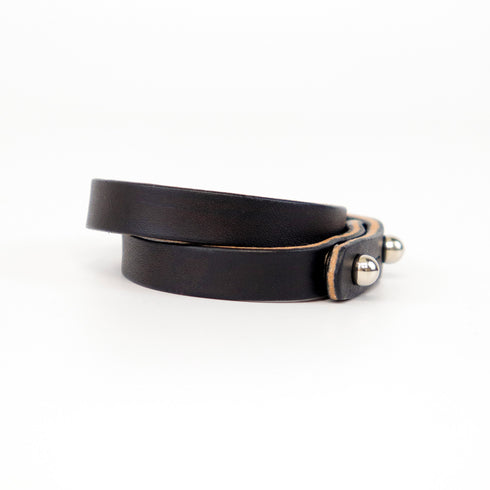 Double Wrap Cuff in Black vegetable‑tanned leather with stainless steel studs – sleek leather wrist accessory
