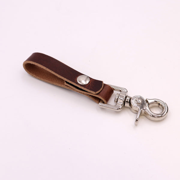 Trigger Snap Keychain in Buck Brown full‑grain leather with solid brass hardware – handcrafted leather keychain